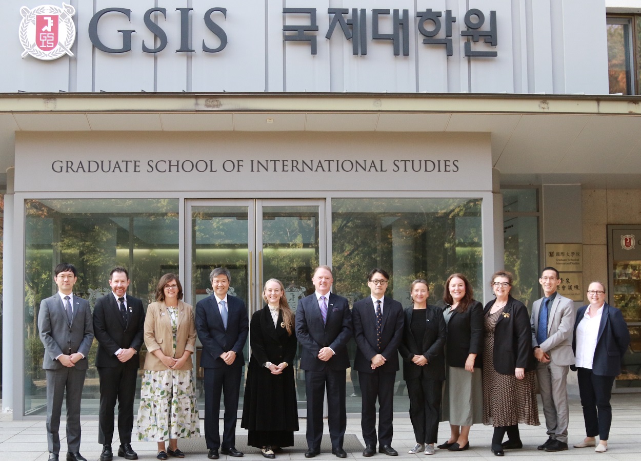 photo of group of people standing in front of Seoul National University